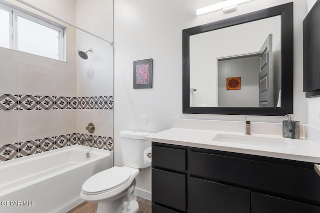 full bathroom with toilet, washtub / shower combination, vanity, and wood finished floors