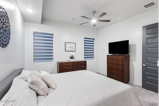 carpeted bedroom featuring baseboards and ceiling fan