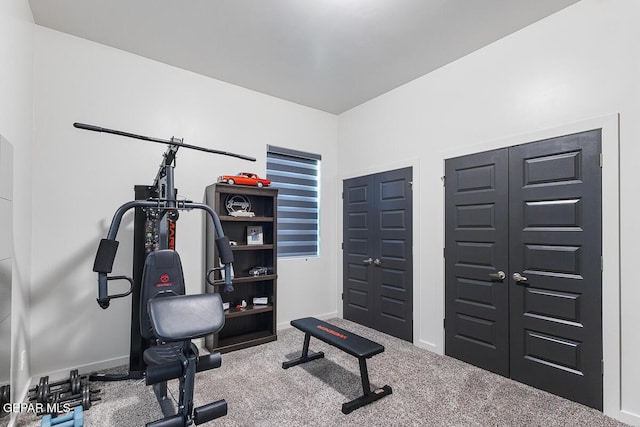 exercise area with carpet flooring and baseboards