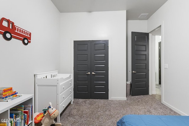 bedroom featuring carpet flooring and baseboards