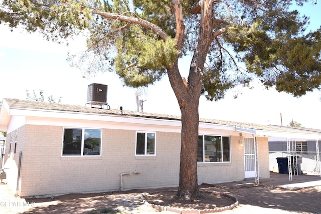 9207 Montgomery Dr, El Paso, TX 79924 - rear view of house with brick siding and central AC unit