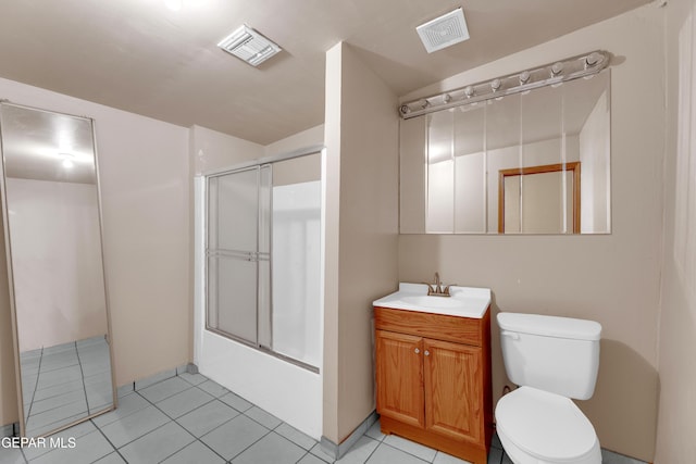 3571 Rebecca Ln, El Paso, TX 79938 - full bath with toilet, tile patterned floors, vanity, and shower / bath combination with glass door
