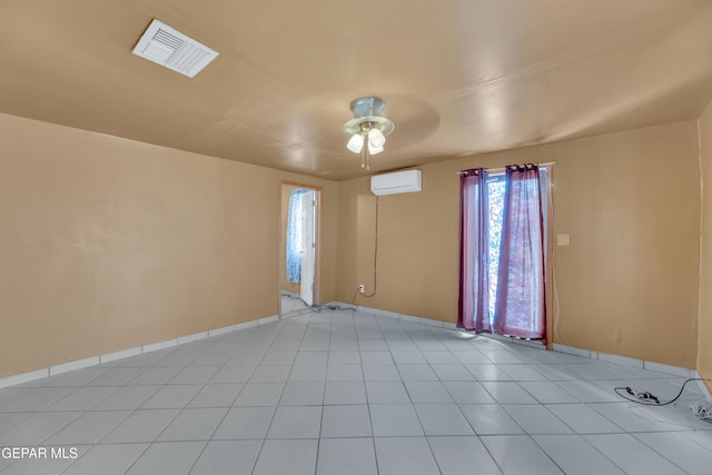 3571 Rebecca Ln, El Paso, TX 79938 - spare room featuring an AC wall unit, ceiling fan, baseboards, and light tile patterned floors