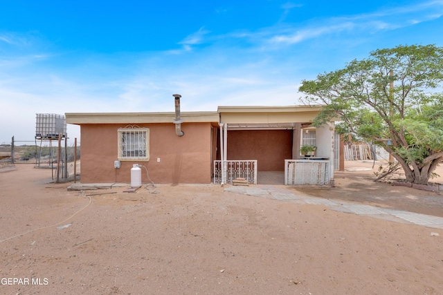 3571 Rebecca Ln, El Paso, TX 79938 - view of front of house with stucco siding and fence