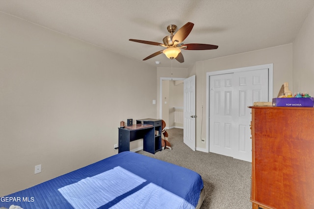 bedroom with carpet flooring, ceiling fan, and a closet
