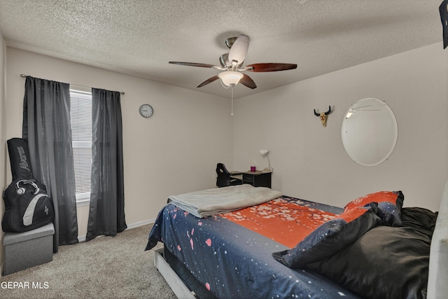 bedroom featuring carpet floors, a ceiling fan, a textured ceiling, and baseboards