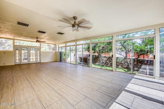 8024 Tonto Pl, El Paso, TX 79904 - unfurnished sunroom featuring french doors and healthy amount of natural light