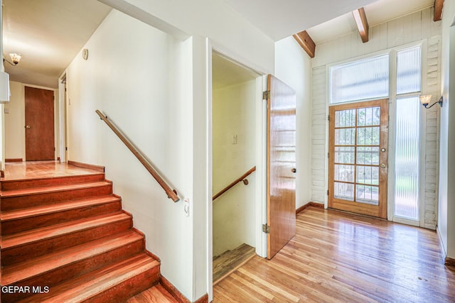 8024 Tonto Pl, El Paso, TX 79904 - staircase featuring wood finished floors, beam ceiling, and baseboards