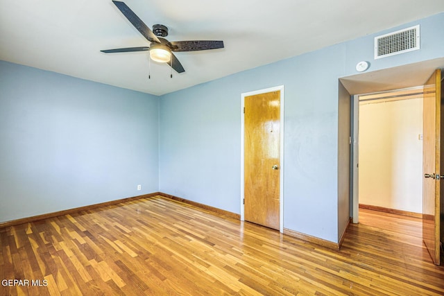 8024 Tonto Pl, El Paso, TX 79904 - unfurnished bedroom with light wood-style flooring, baseboards, and ceiling fan