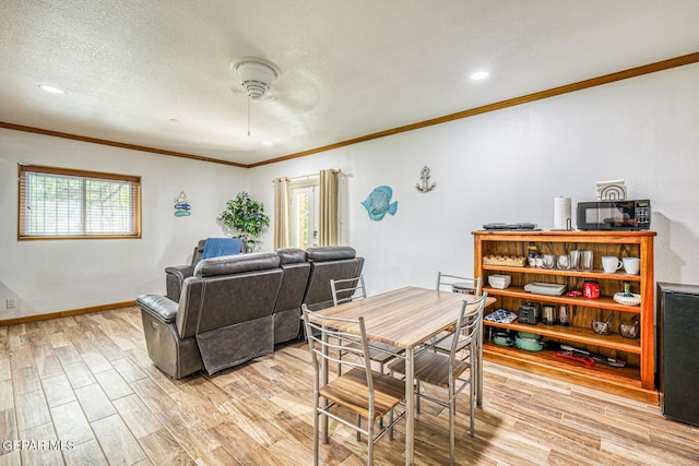 8024 Tonto Pl, El Paso, TX 79904 - dining space with ceiling fan, ornamental molding, light wood finished floors, baseboards, and recessed lighting