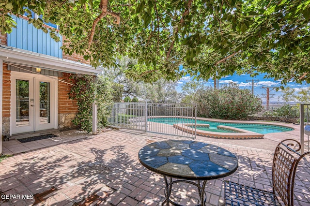 8024 Tonto Pl, El Paso, TX 79904 - view of patio with french doors, fence, and a pool with connected hot tub