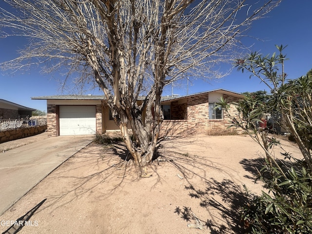 9603 Bahamas St, El Paso, TX 79927 - view of front facade with driveway and a garage