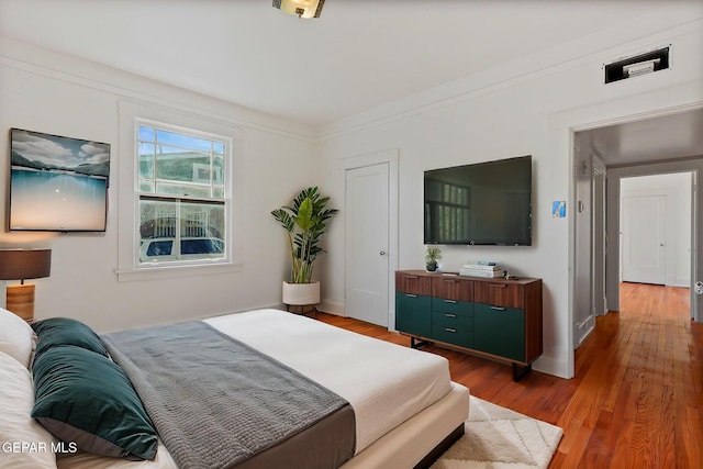 bedroom with wood finished floors