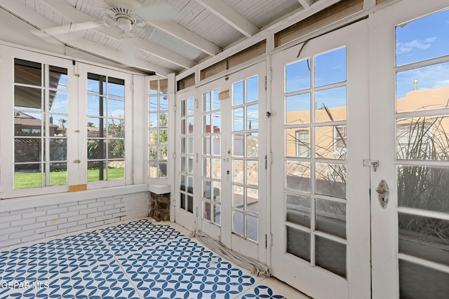 unfurnished sunroom featuring french doors and beam ceiling
