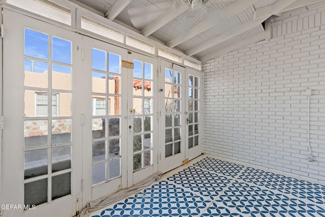 unfurnished sunroom with french doors