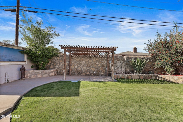 view of yard with a pergola and a patio