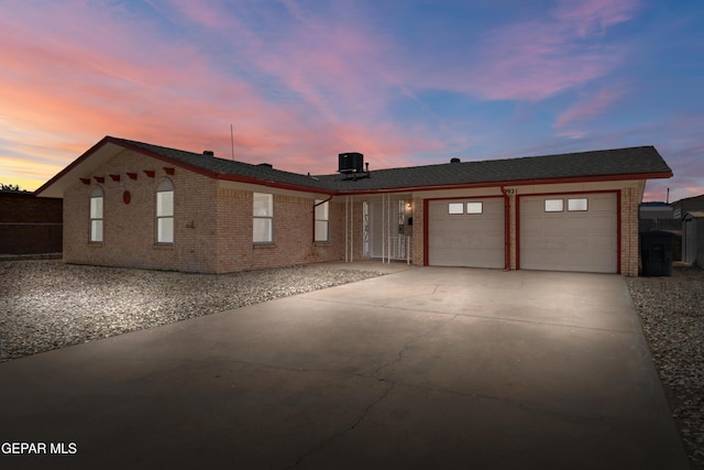 9921 Minuteman St, El Paso, TX 79924 - single story home featuring brick siding, an attached garage, and driveway