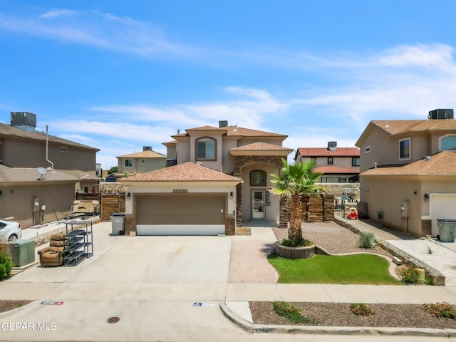 3096 Java Chip Pl, El Paso, TX 79938 - mediterranean / spanish-style house featuring a garage, stucco siding, driveway, a residential view, and central air condition unit