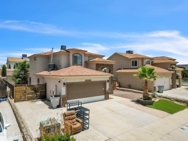 3096 Java Chip Pl, El Paso, TX 79938 - mediterranean / spanish home with stucco siding, driveway, a garage, and cooling unit