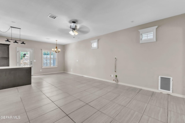 3096 Java Chip Pl, El Paso, TX 79938 - unfurnished living room featuring a chandelier, a ceiling fan, baseboards, and light tile patterned floors