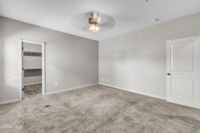 3096 Java Chip Pl, El Paso, TX 79938 - unfurnished bedroom with carpet, a walk in closet, baseboards, a ceiling fan, and a closet