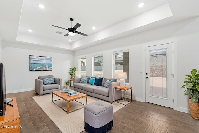 14740 Jack White Ave, El Paso, TX 79938 - living room featuring a tray ceiling, wood finished floors, ceiling fan, baseboards, and recessed lighting