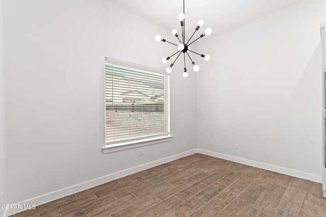 14740 Jack White Ave, El Paso, TX 79938 - unfurnished room with a chandelier, dark wood-style floors, and baseboards