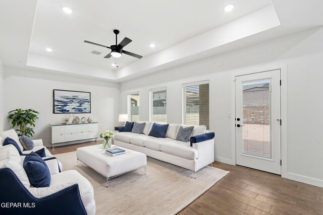 14740 Jack White Ave, El Paso, TX 79938 - living room featuring a raised ceiling, a ceiling fan, wood finished floors, baseboards, and recessed lighting