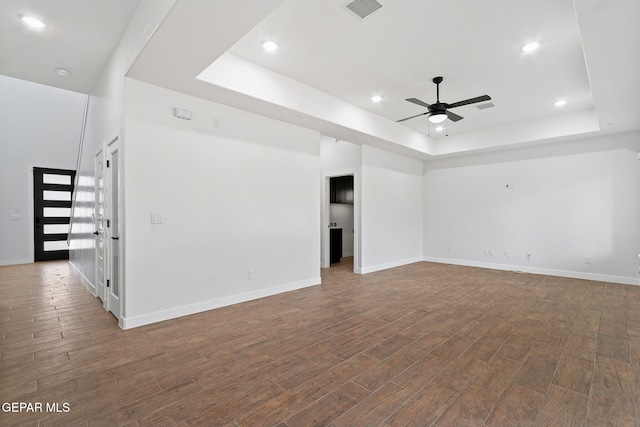 14740 Jack White Ave, El Paso, TX 79938 - unfurnished room with a raised ceiling, dark wood finished floors, a ceiling fan, baseboards, and recessed lighting