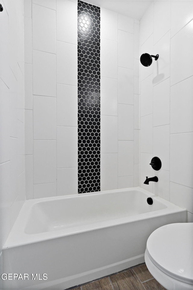 14740 Jack White Ave, El Paso, TX 79938 - full bathroom with bathing tub / shower combination, wood finished floors, and toilet
