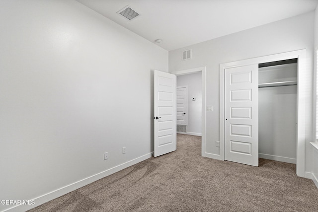 14740 Jack White Ave, El Paso, TX 79938 - unfurnished bedroom with carpet flooring, baseboards, and a closet