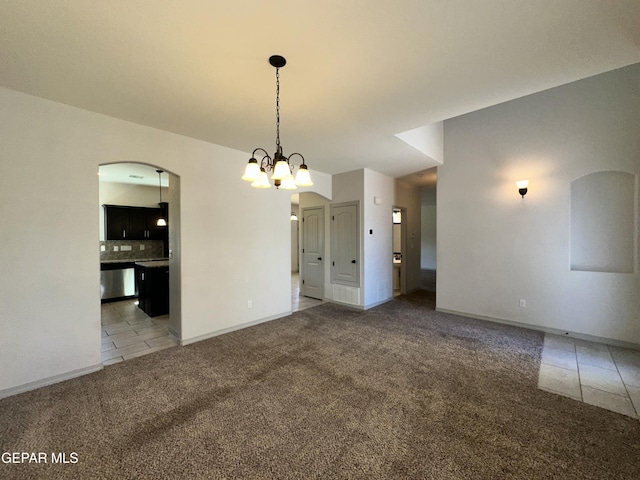 13192 Lost Willow, El Paso, TX 79938 - unfurnished dining area with carpet floors, tile patterned flooring, a chandelier, arched walkways, and baseboards