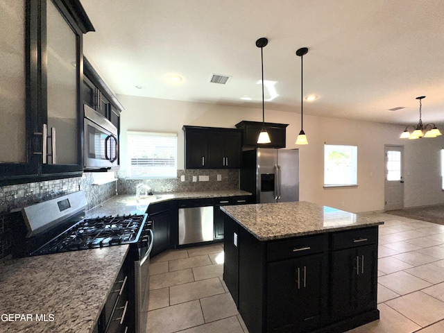 13192 Lost Willow, El Paso, TX 79938 - kitchen with appliances with stainless steel finishes, dark cabinets, light tile patterned flooring, backsplash, and recessed lighting