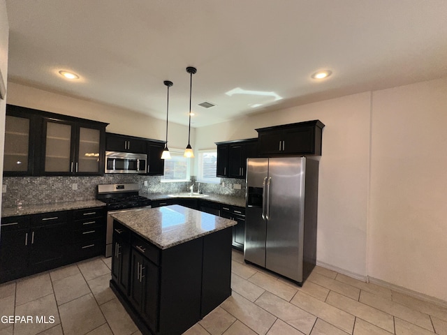 13192 Lost Willow, El Paso, TX 79938 - kitchen featuring appliances with stainless steel finishes, dark cabinets, tasteful backsplash, and recessed lighting