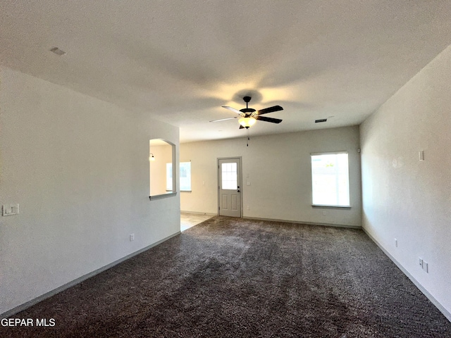 13192 Lost Willow, El Paso, TX 79938 - unfurnished room with ceiling fan, light colored carpet, baseboards, and arched walkways