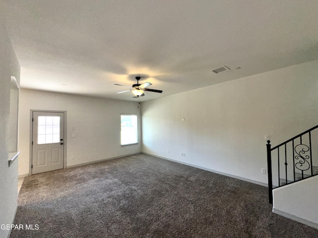 13192 Lost Willow, El Paso, TX 79938 - unfurnished living room featuring a ceiling fan, carpet, plenty of natural light, and baseboards