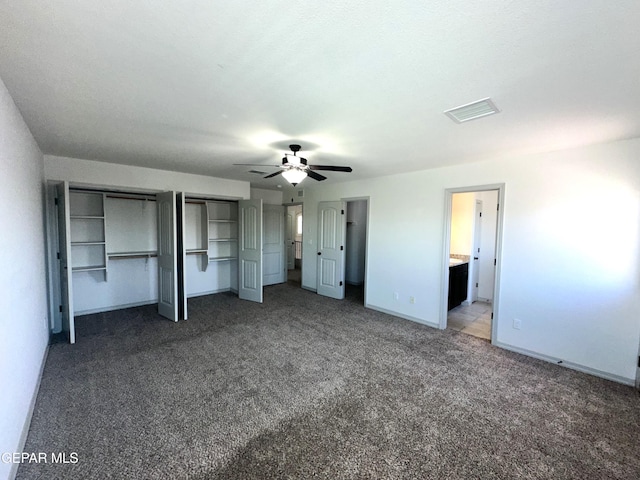 13192 Lost Willow, El Paso, TX 79938 - unfurnished bedroom featuring carpet, baseboards, two closets, ensuite bathroom, and a ceiling fan