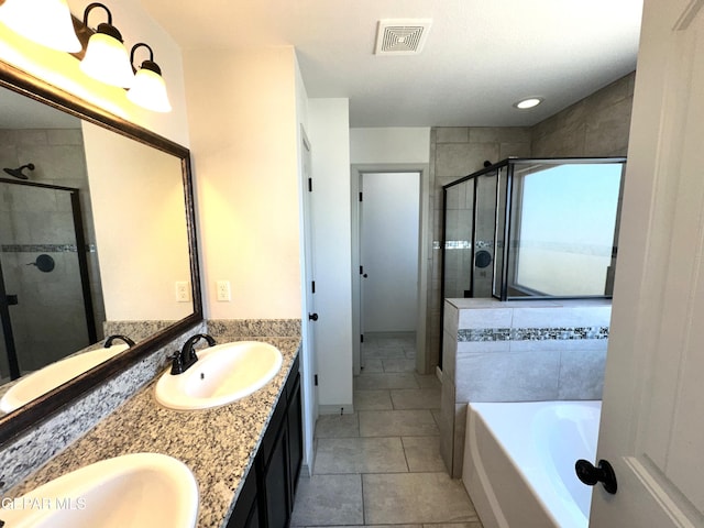 13192 Lost Willow, El Paso, TX 79938 - full bathroom with a stall shower, a garden tub, double vanity, and tile patterned floors
