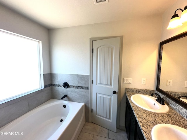 13192 Lost Willow, El Paso, TX 79938 - full bathroom featuring tile patterned flooring, a bath, and double vanity