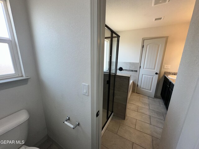 13192 Lost Willow, El Paso, TX 79938 - full bath with a shower stall, toilet, vanity, and tile patterned floors