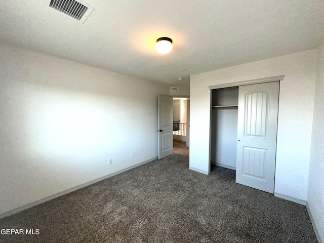 13192 Lost Willow, El Paso, TX 79938 - unfurnished bedroom with dark colored carpet, a closet, and baseboards