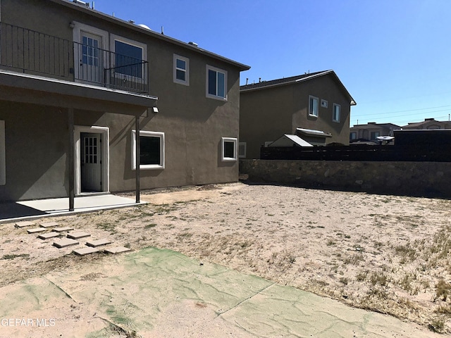 13192 Lost Willow, El Paso, TX 79938 - rear view of house with a balcony, stucco siding, and a patio area
