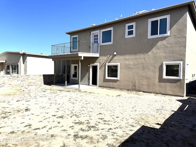 13192 Lost Willow, El Paso, TX 79938 - rear view of house featuring a balcony, stucco siding, and a patio area