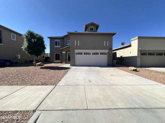 13192 Lost Willow, El Paso, TX 79938 - view of front of house featuring stucco siding, a garage, and concrete driveway