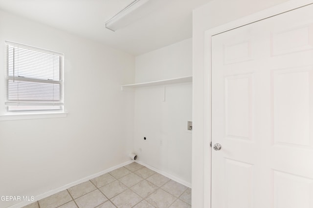 laundry room featuring electric dryer hookup, hookup for a washing machine, and baseboards