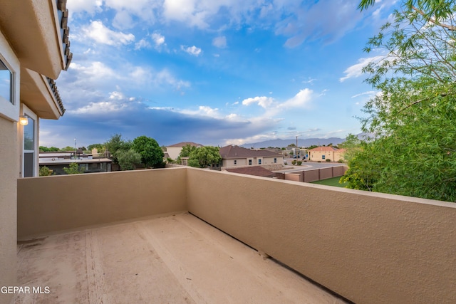 balcony with a residential view and a mountain view