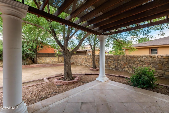 view of patio with a fenced backyard and a pergola