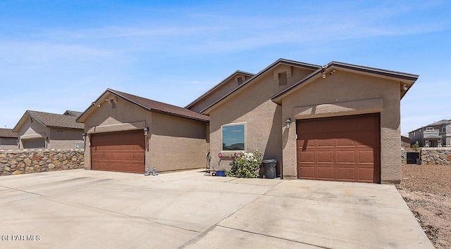 14840 Pebble Hills Blvd, El Paso, TX 79938 - view of front of property featuring stucco siding, driveway, and an attached garage