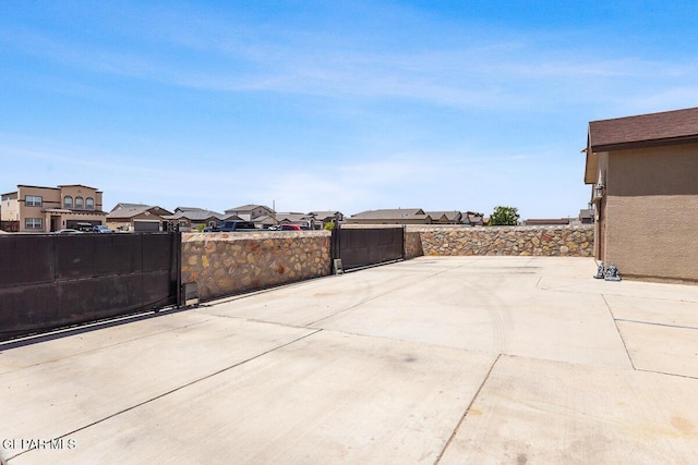 14840 Pebble Hills Blvd, El Paso, TX 79938 - view of patio / terrace featuring fence, a residential view, and a gate