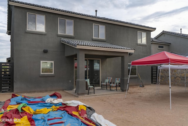 13673 Samlesbury Ave, Horizon City, TX 79928 - rear view of property with a patio, stucco siding, and a tiled roof